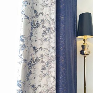 Vải in hoa cành cây màu trắng nền xanh